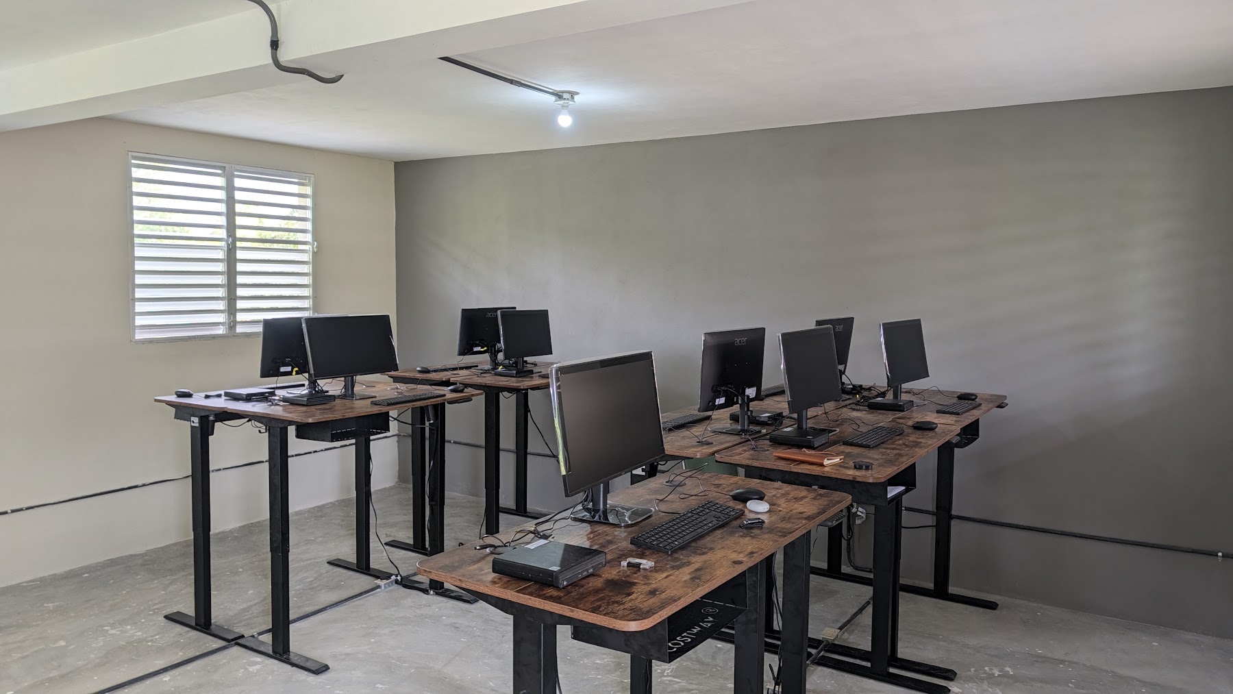 Installed computer workstations along the lab wall
