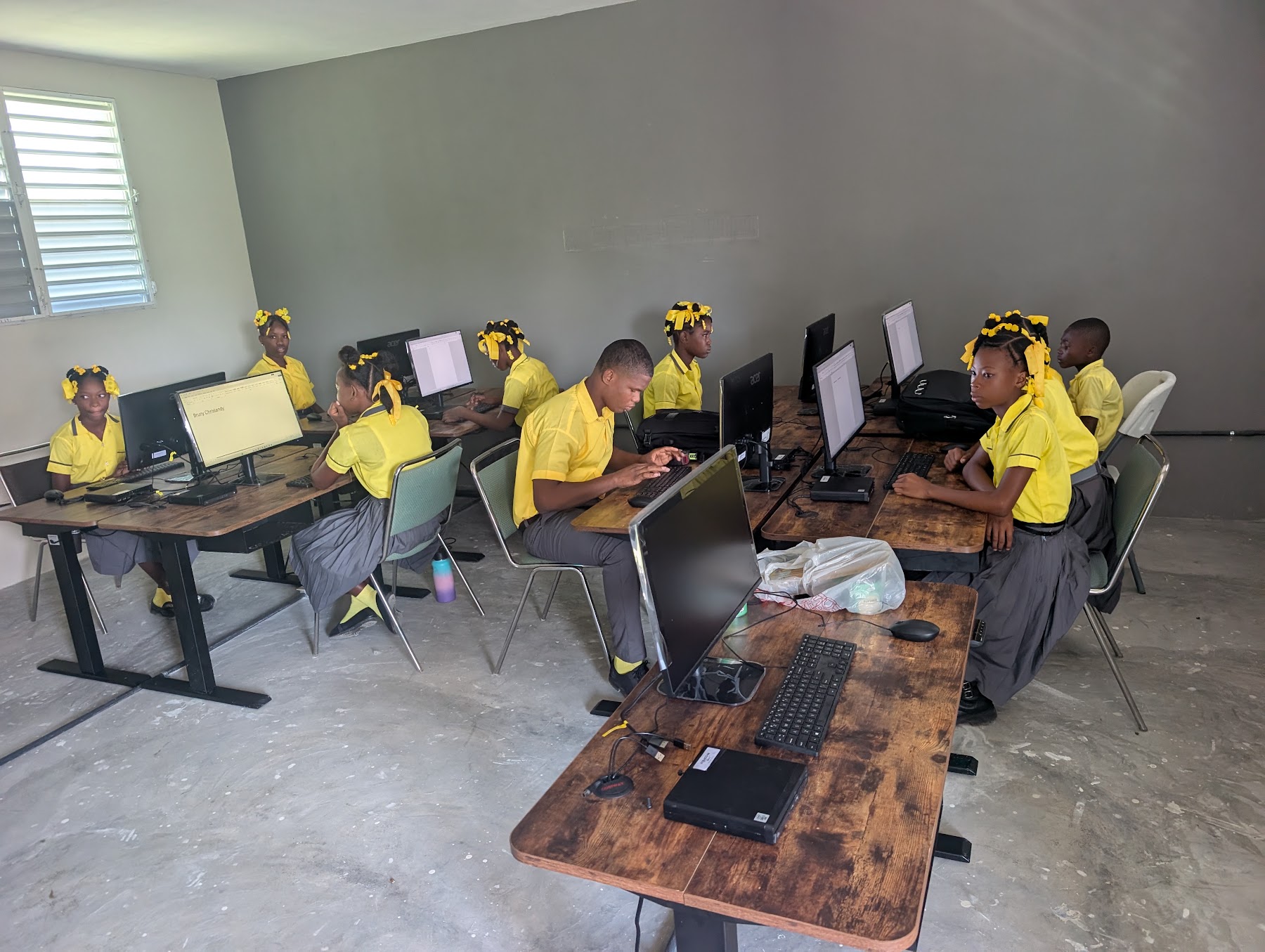 Students using computers across the lab